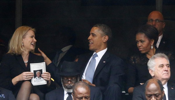 U.S. President Obama shares a moment with Denmark's PM Thorning-Schmidt during memorial service for Mandela in Johannesburg