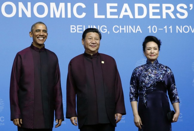 U.S. President Obama poses for photographs with China's President Xi and Xi's wife Peng during the APEC Welcome Banquet at Beijing National Aquatics Center, or the Water Cube, in Beijing