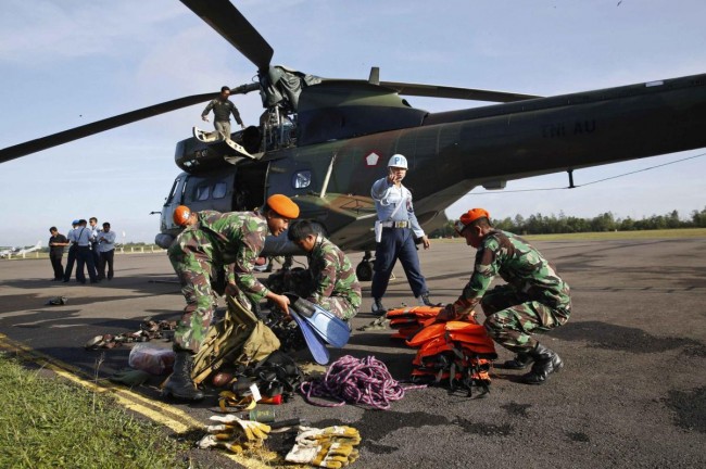 Indonesian Special Forces prepare for a recovery mission for AirAsia flight QZ8501 at the airport in Pangkalan Bun