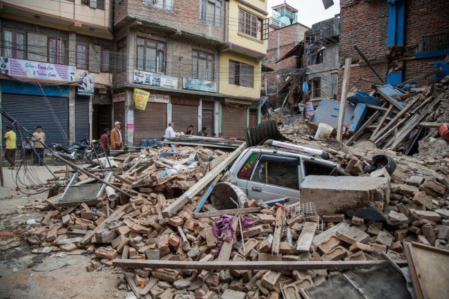 A taxi is buried under debris from a collapsed building in Thamel following an earthquake on April 25, 2015 in Kathmandu, Nepal. (Photo by Omar Havana/Getty Images)