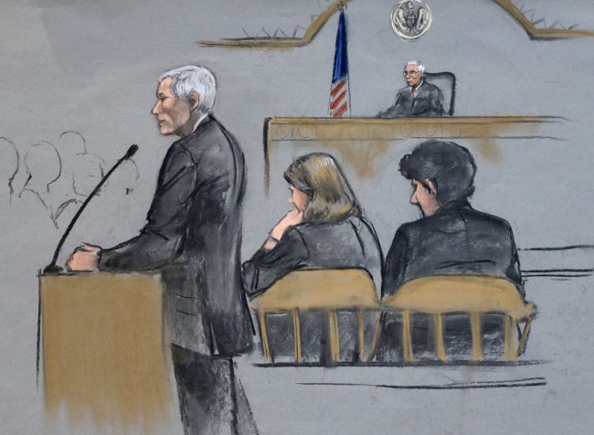 In this courtroom sketch, defense attorney David Bruck addresses the jury during the penalty phase in the trial of Dzhokhar Tsarnaev, seated at right, on Monday, April 27, 2015, in federal court in Boston. Tsarnaev, 21, was convicted in the twin bombings that killed three spectators and wounded more than 260 other people near the finish line of the Boston Marathon on April 15, 2013. He was also convicted of killing an MIT police officer during the getaway attempt with his brother. (Jane Flavell Collins via AP)