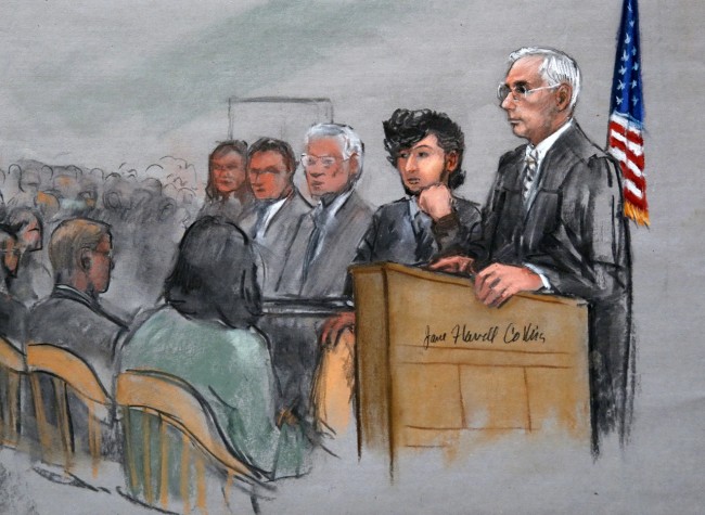 In this courtroom sketch, Boston Marathon bombing suspect Dzhokhar Tsarnaev, second from right, is depicted with his lawyers, left, beside U.S. District Judge George O'Toole Jr., right, as O'Toole addresses a pool of potential jurors in a jury assembly room at the federal courthouse, Monday, Jan. 5, 2015, in Boston. Tsarnaev is charged with the April 2013 attack that killed three people and injured more than 260. His trial is scheduled to begin on Jan. 26. He could face the death penalty if convicted. (AP Photo/Jane Flavell Collins)