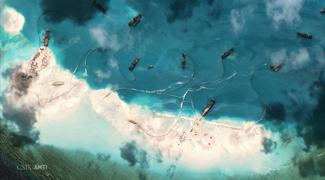 Dredgers deposit sand on the northern rim of the Mischief Reef, located 216 km (135 miles) west of the Philippine island of Palawan, in this Center for Strategic and International Studies (CSIS) Asia Maritime Transparency Initiative satellite image taken on February 1, 2015 and released to Reuters on April 9, 2015. China on April 9, 2015 sketched out plans for the islands it is creating in the disputed South China Sea, saying they would be used for military defence as well as to provide civilian services that would benefit other countries. The annotation on the photo is by CSIS's Asia Maritime Transparency Initiative.  REUTERS/CSIS's Asia Maritime Transparency Initiative/Digital Globe/Handout   TPX IMAGES OF THE DAY ATTENTION EDITORS - THIS PICTURE WAS PROVIDED BY A THIRD PARTY. REUTERS IS UNABLE TO INDEPENDENTLY VERIFY THE AUTHENTICITY, CONTENT, LOCATION OR DATE OF THIS IMAGE. NO SALES. NO ARCHIVES. FOR EDITORIAL USE ONLY. NOT FOR SALE FOR MARKETING OR ADVERTISING CAMPAIGNS. THIS PICTURE IS DISTRIBUTED EXACTLY AS RECEIVED BY REUTERS, AS A SERVICE TO CLIENTS.