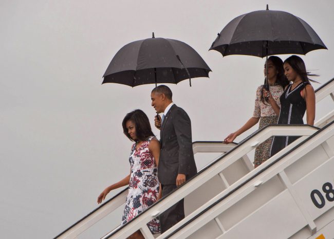 US President Barack Obama (2nd L), First Lady Michelle Obama (L) and daughters Malia (2nd R) and Sasha (R) disembark from Air Force One at the Jose Marti International Airport in Havana on March 20, 2016. Obama arrived in Cuba to bury the hatchet in a more than half-century-long Cold War conflict that turned the communist island and its giant neighbor into bitter enemies.     AFP PHOTO/Nicholas KAMM / AFP / NICHOLAS KAMM        (Photo credit should read NICHOLAS KAMM/AFP/Getty Images)